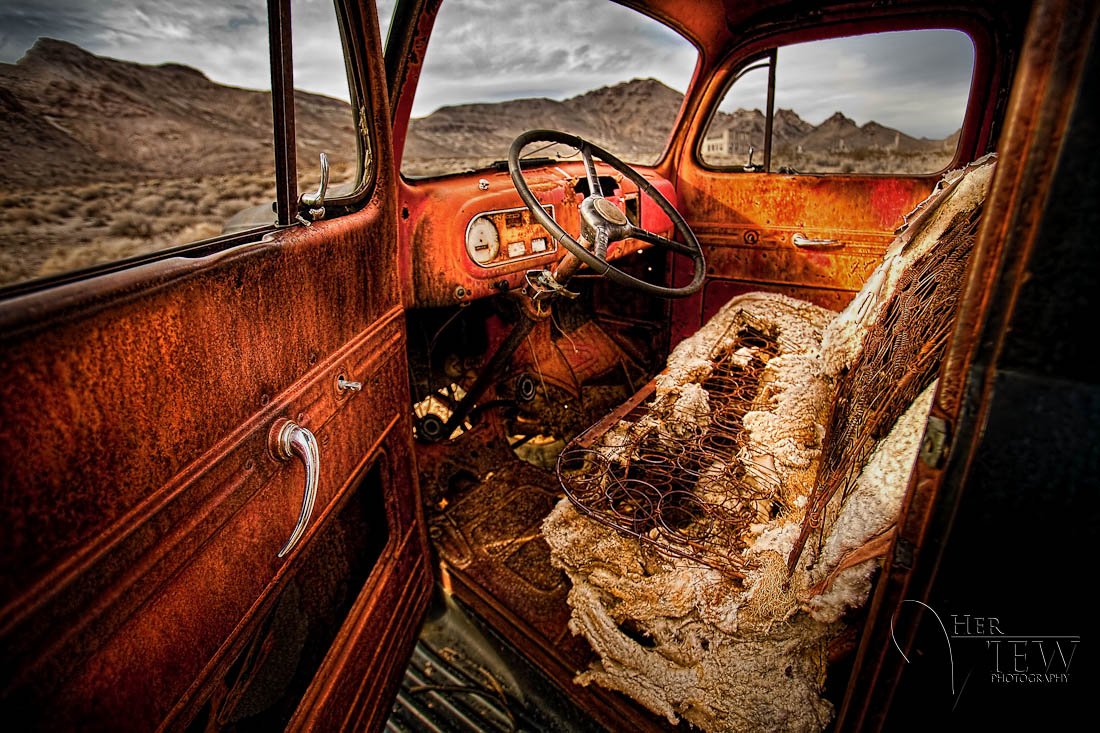 HDR photograph of the inside of a truck in the Rhyolite Ghost town near death valley